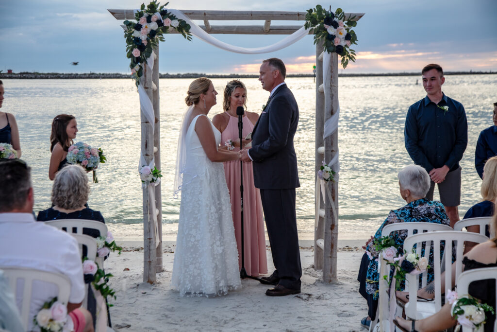 wedding ceremony on the beach at sunset