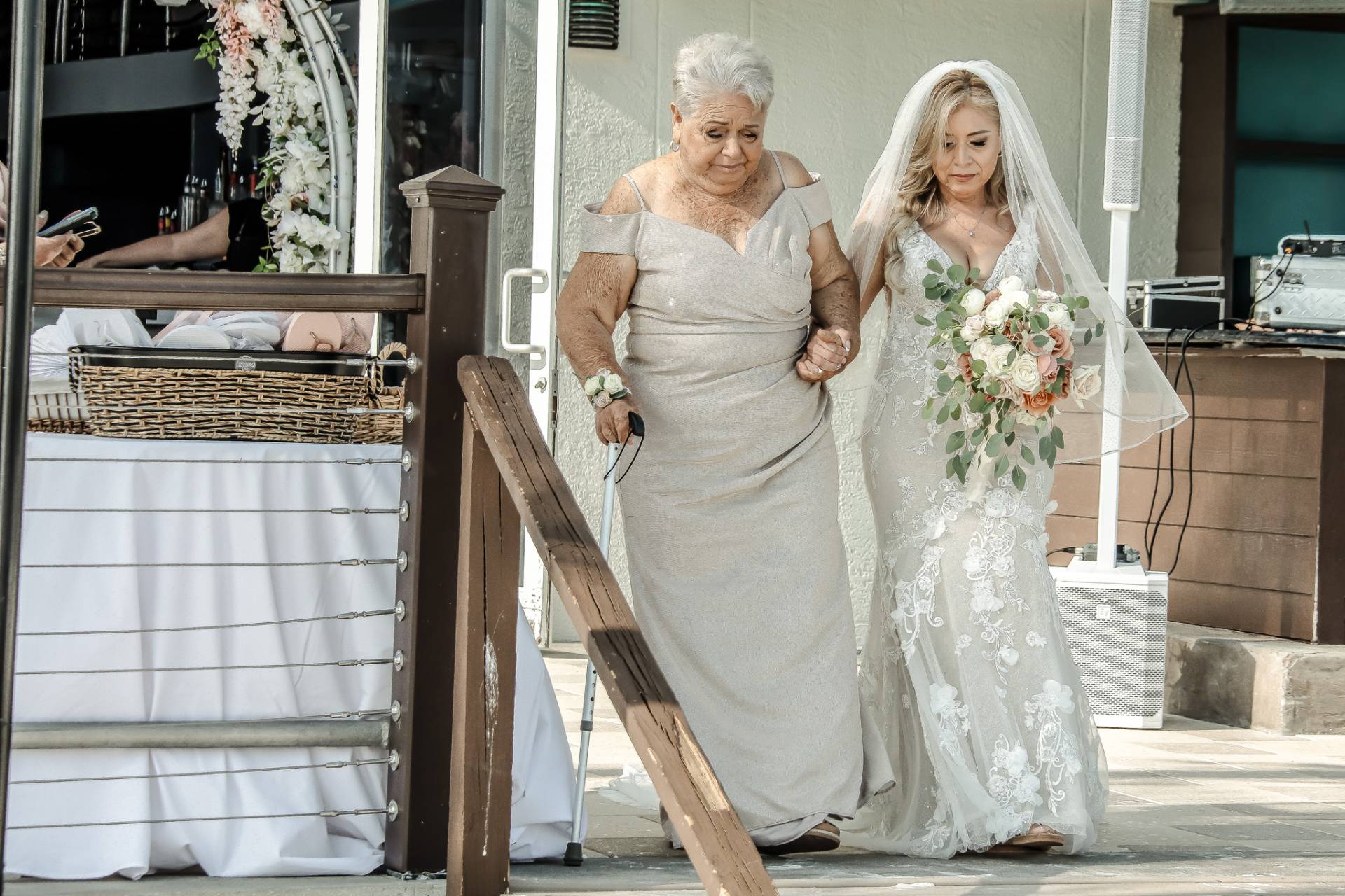 bride with her mother walking down the isle to ceremony