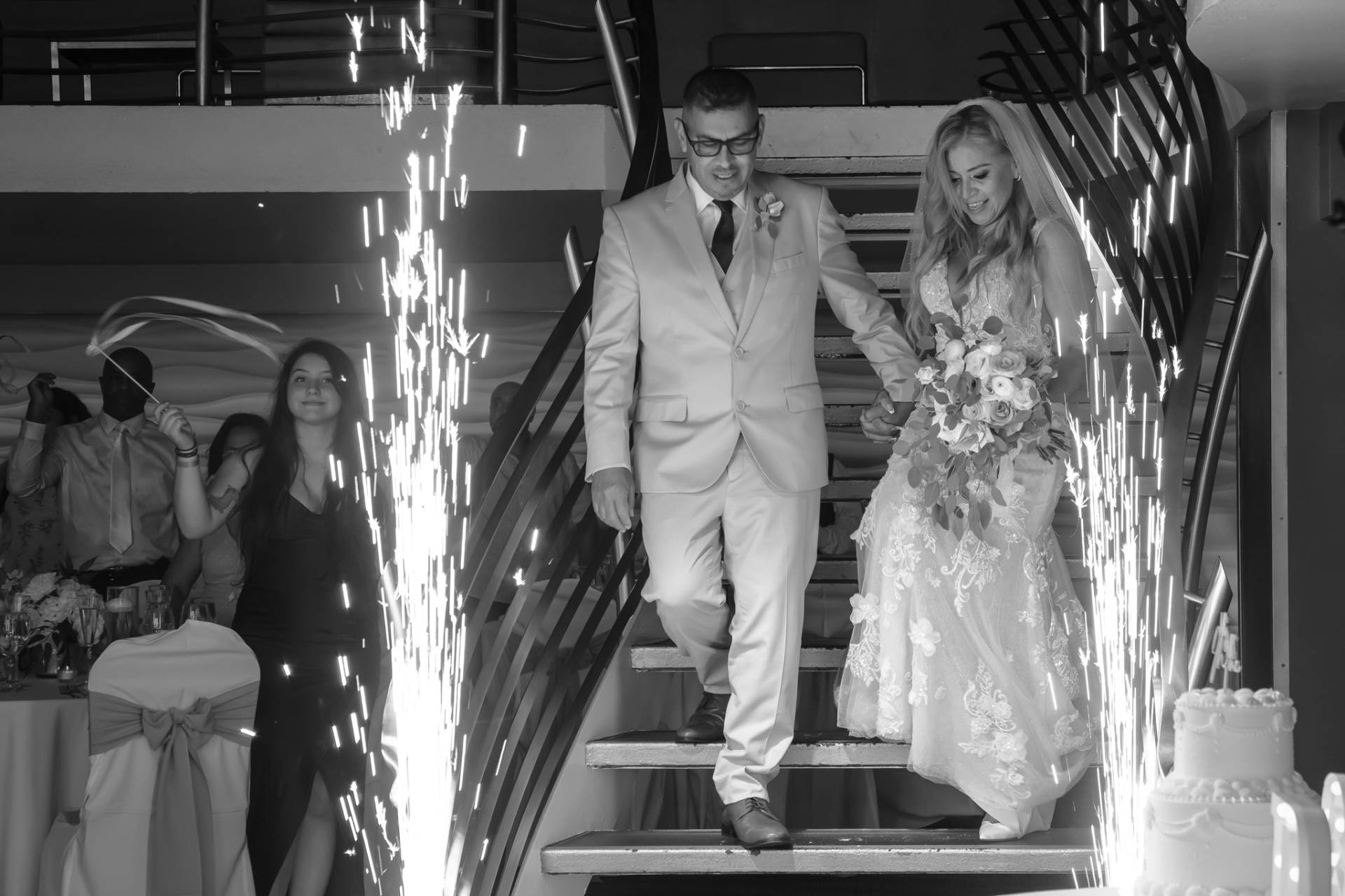 bride and groom entering their wedding reception