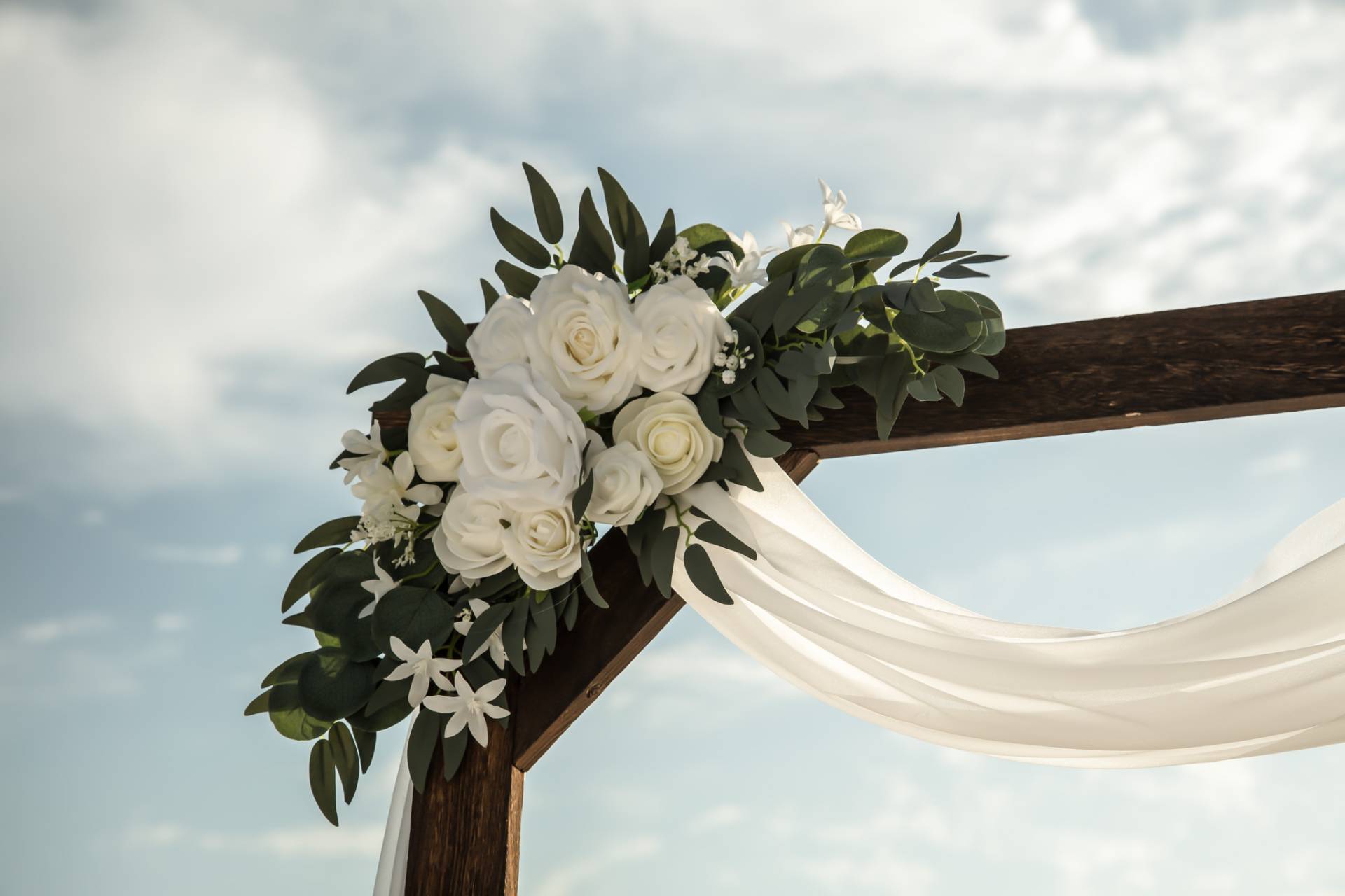 flowers on wedding arch